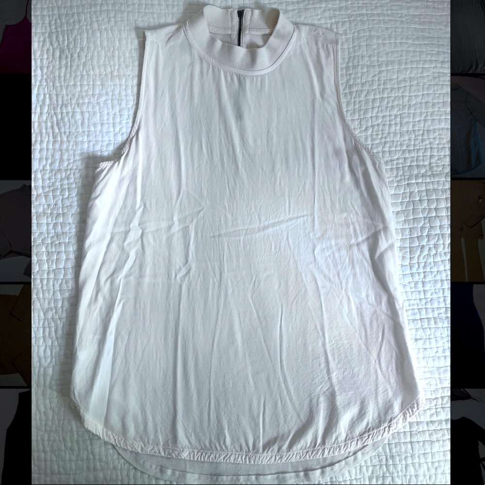 Off-white sleeveless mock turtleneck blouse